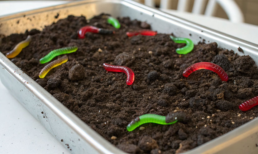 An AI image of a dirt cake made with OREOs and gummy worms