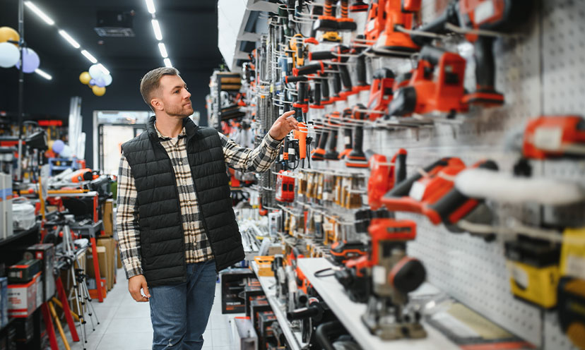 Man in vest shopping for tools