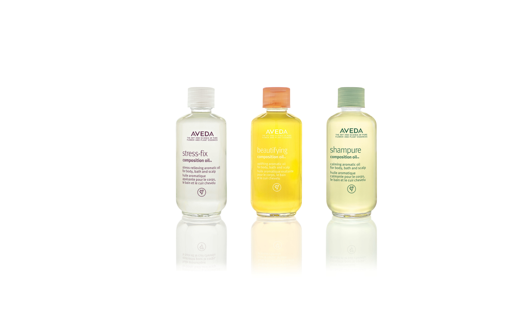 Image of three bottles of Composition Oil from Aveda