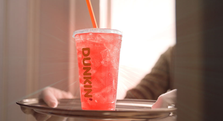 Pink Spritz Refresher from Dunkin' being served on a tray