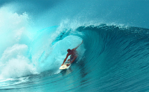 Picture of someone riding a surfboard in a wave