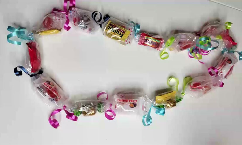 A necklace made of candy and ribbon