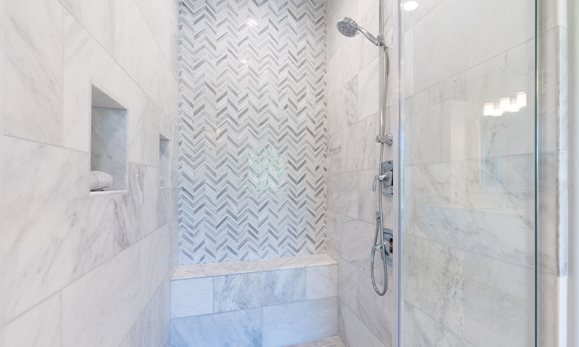 Bathroom with a walk in shower with bench
