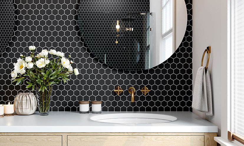 Bathroom with a black geometric tile wall